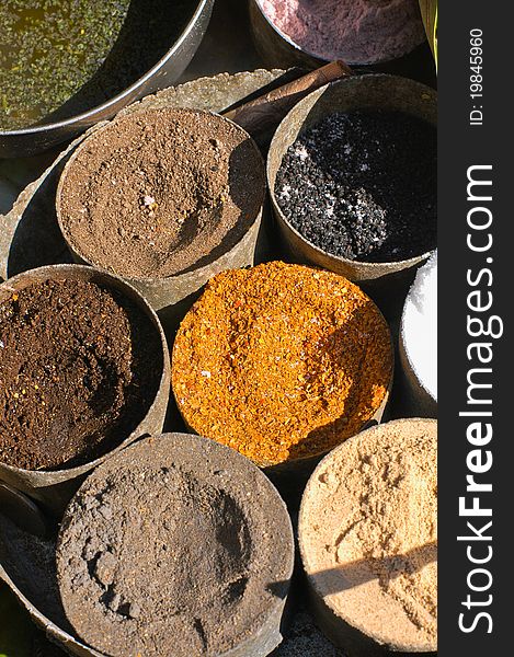 Condiments, seasoning and ground spices for Indian bhelpuri snack at a chaat stand in Pahar Ganj street market, New Delhi, India. Condiments, seasoning and ground spices for Indian bhelpuri snack at a chaat stand in Pahar Ganj street market, New Delhi, India.