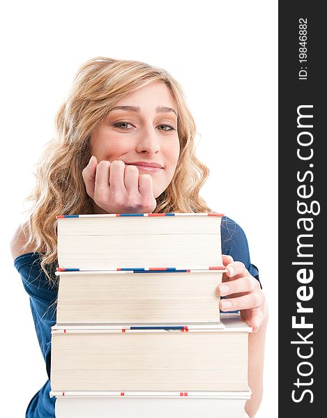 Beautiful young lady leaning on a stack of books and thinking at her future isolated on white background. Beautiful young lady leaning on a stack of books and thinking at her future isolated on white background