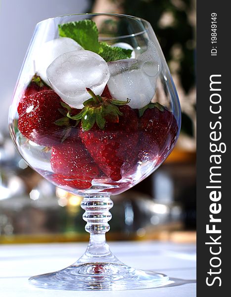 Fresh strawberries on ice in brandy glass. Fresh strawberries on ice in brandy glass