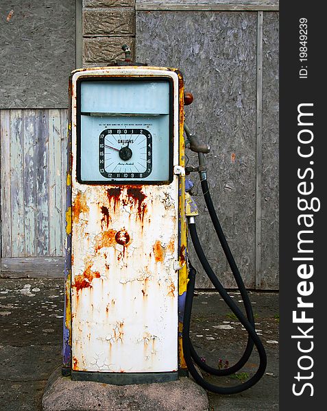 A derelict Village gasoline/petrol pump which has fallen into disrepair and is decaying and rusting away. A derelict Village gasoline/petrol pump which has fallen into disrepair and is decaying and rusting away.