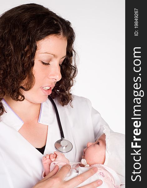 Doctor holds a baby on a white. Doctor holds a baby on a white