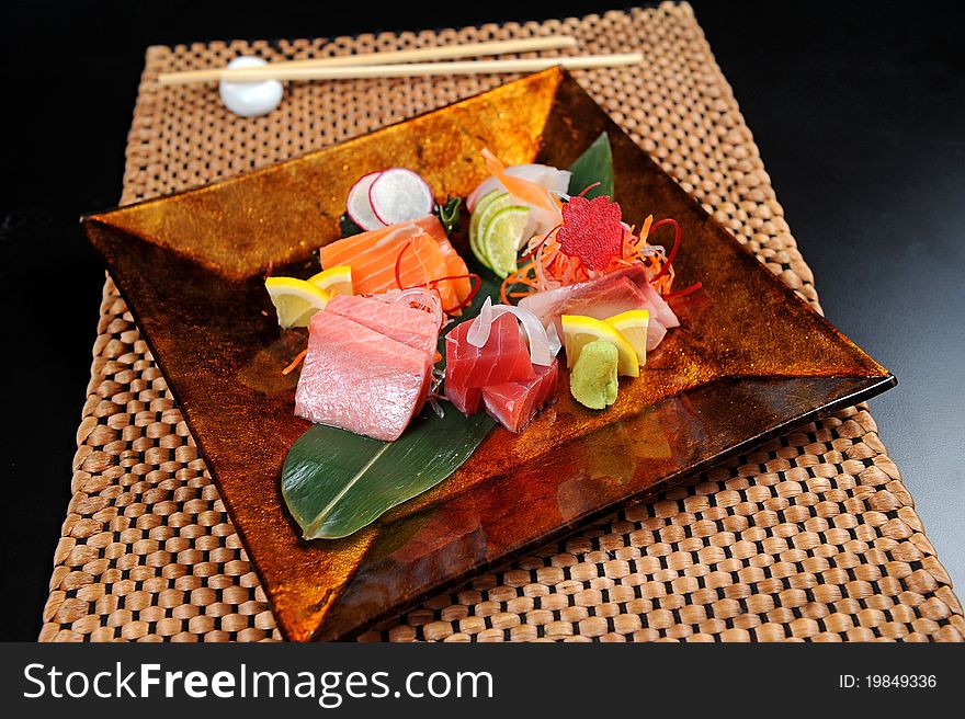 Assorted japanese sushi on a gold plate