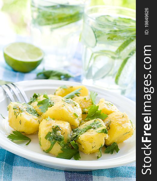 Potato salad with parsley and olive oil. Selective focus