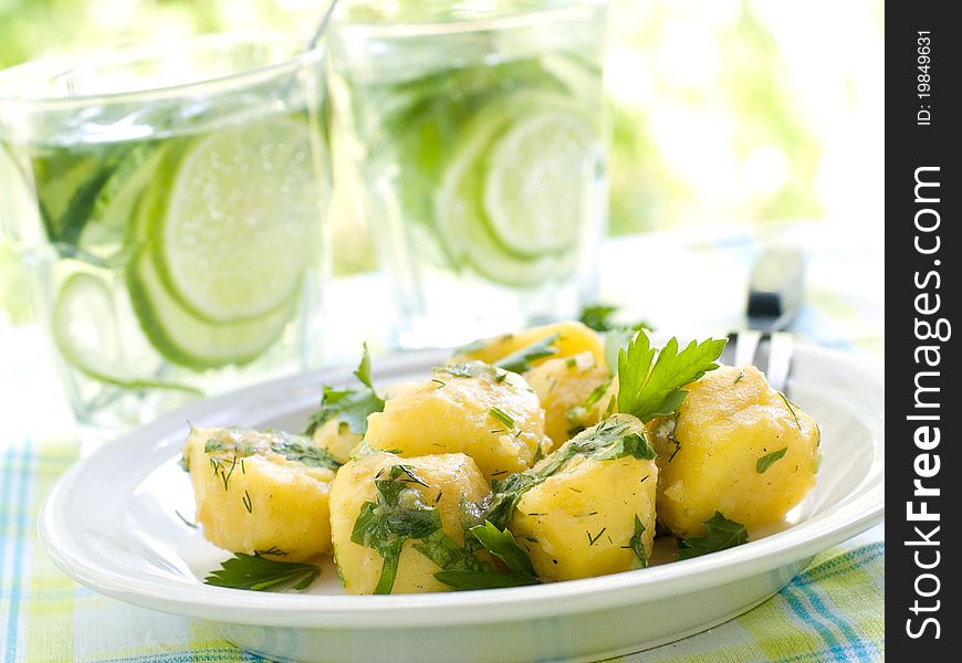 Potato salad with parsley and olive oil. Selective focus