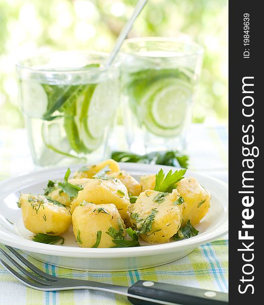 Potato salad with parsley and olive oil. Selective focus