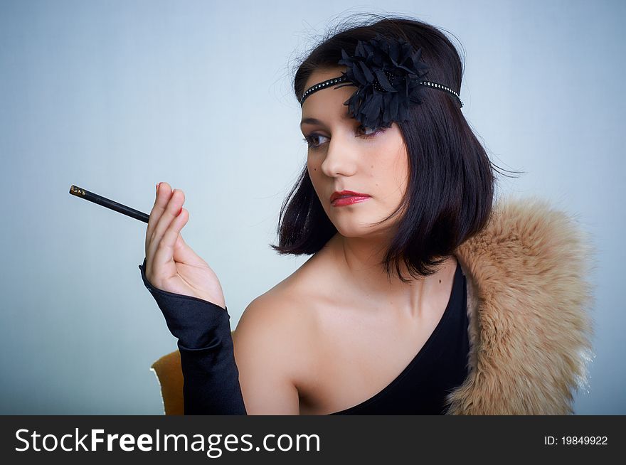 Retro portrait of a young woman in studio