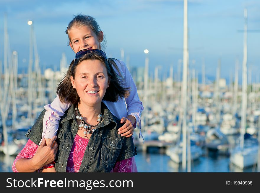 Portrait Of A Girl With Her Mother Near Yachts