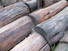 Background - Rows Of Rough Wood Trunks Stock Photography