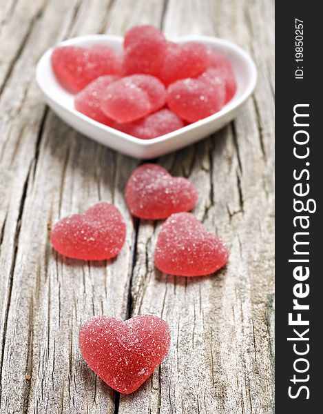 Red heart shaped jelly sweets on a rustic background. Red heart shaped jelly sweets on a rustic background