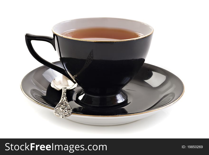 Black tea cup on a white background with space for text. Black tea cup on a white background with space for text