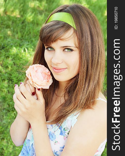 Girl  Holds The Flower