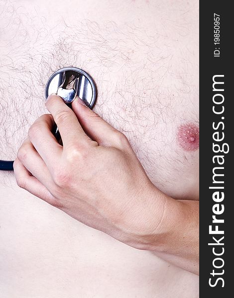 Stethoscope exam studio shot on man's chest