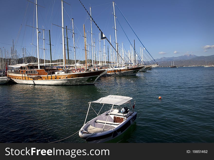 Small and large boats on water