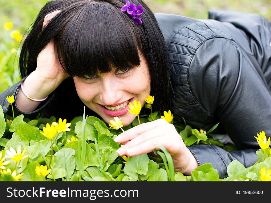 Woman sniffing flowers