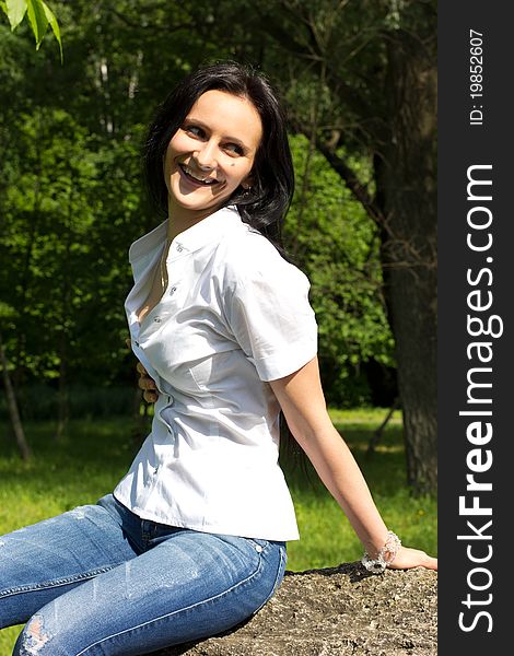 Smiling woman relaxing at the park. Smiling woman relaxing at the park