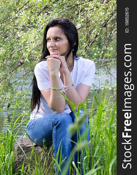 Smiling woman relaxing at the park. Smiling woman relaxing at the park