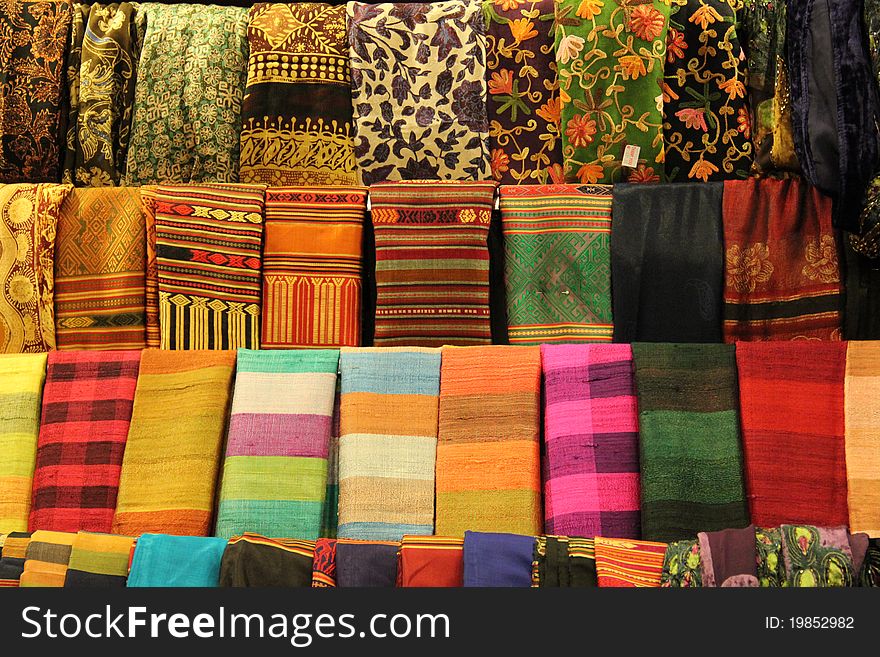 :ots of different fabric exposed in a market. :ots of different fabric exposed in a market