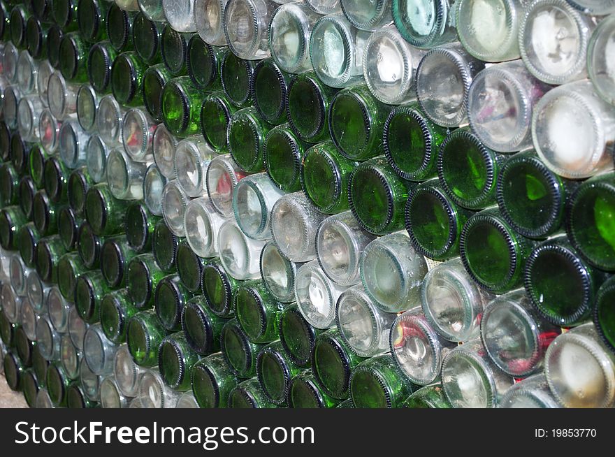A lot of beer bottle arrange in a row .
