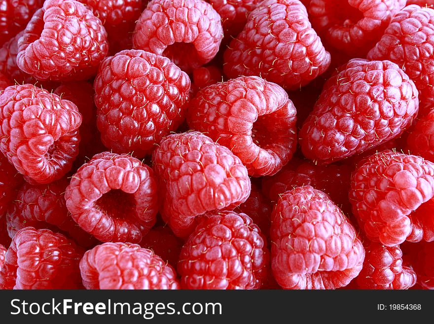 Ripe sweet fresh raspberries background