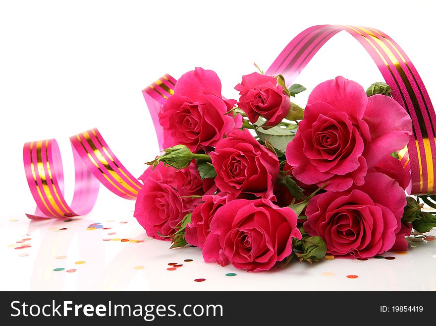 Bouquet of roses and streamer on a white background