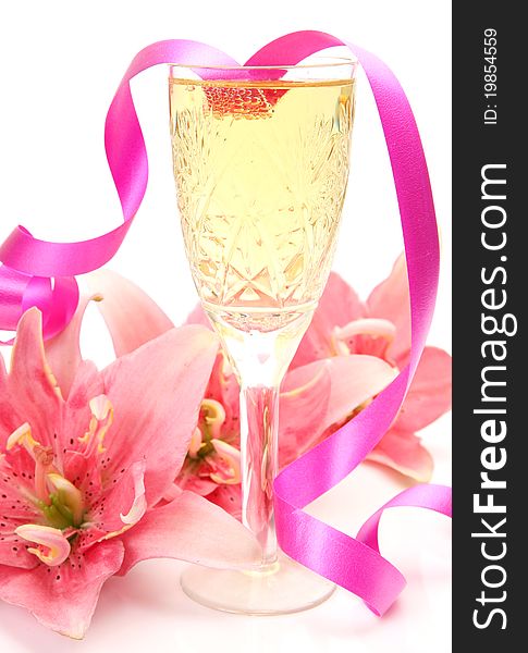 Pink lilies and champagne on a white background