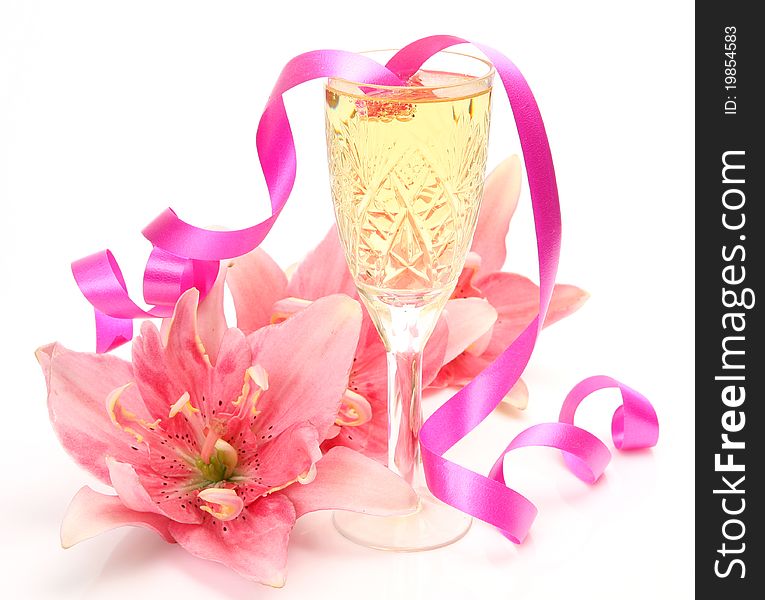 Pink lilies and champagne on a white background