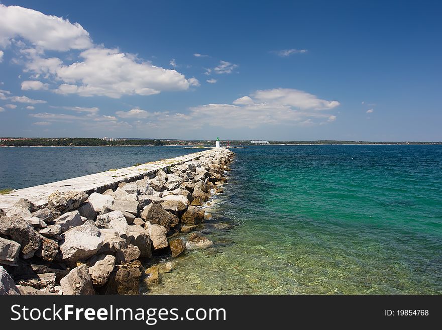 Landscape with breakwater receding into the distance