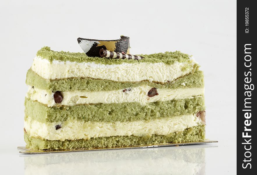 Green tea cake on white background