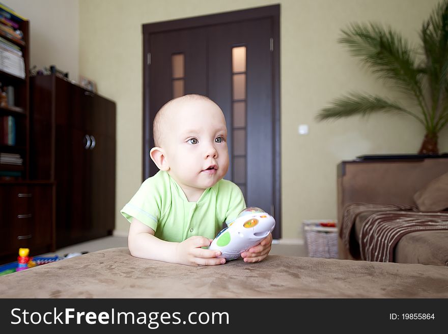 Sweet funny little baby dreamer at home