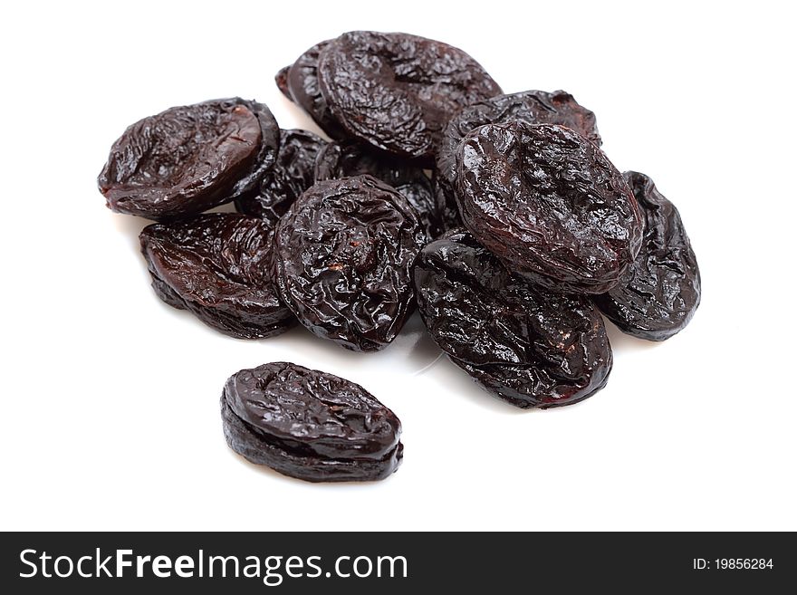 Dried plums isolated on a white background. Dried plums isolated on a white background