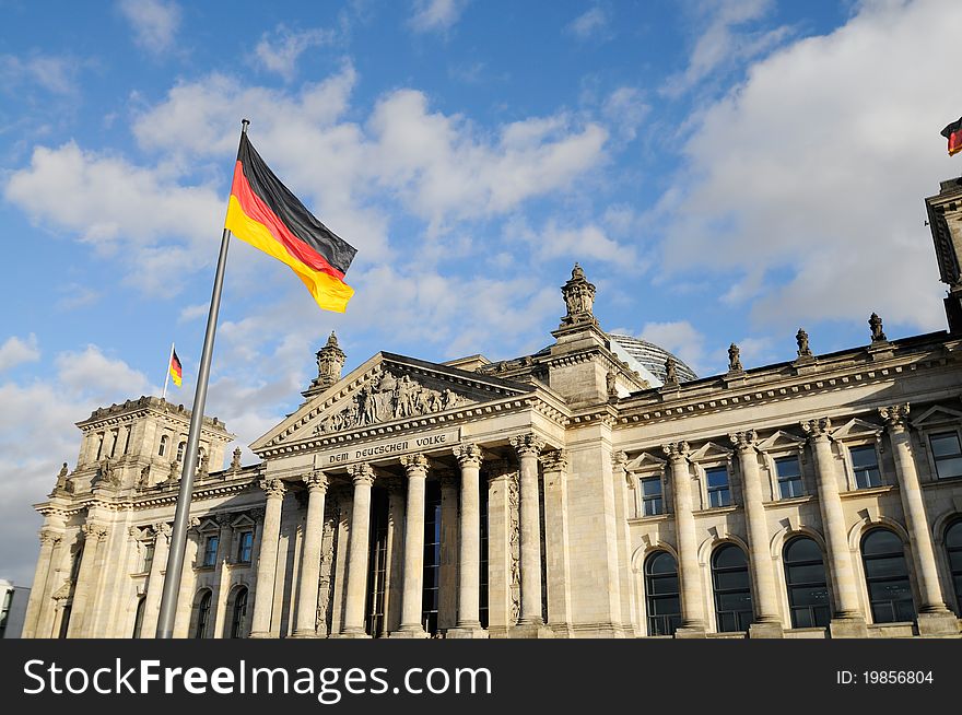 Front view of the Reichstag with german flags