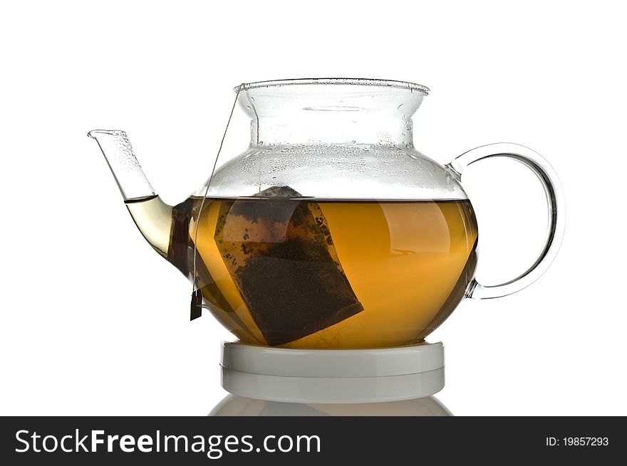 A glass teapot on a white background