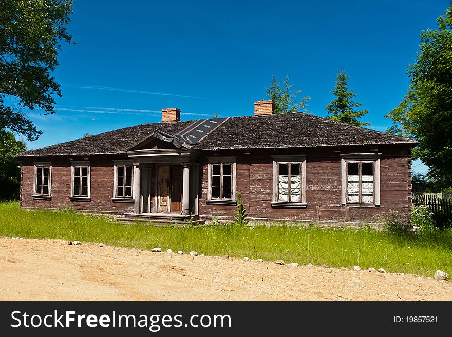 Wooden Hut In Village