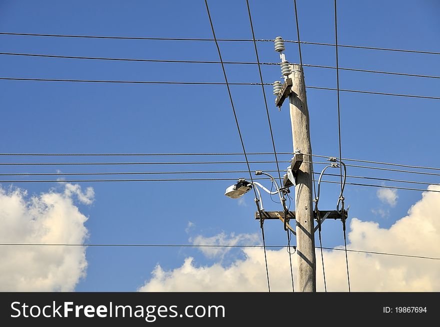 Metallic electric pole with a complex network of power cables running through it on sky background. Metallic electric pole with a complex network of power cables running through it on sky background.