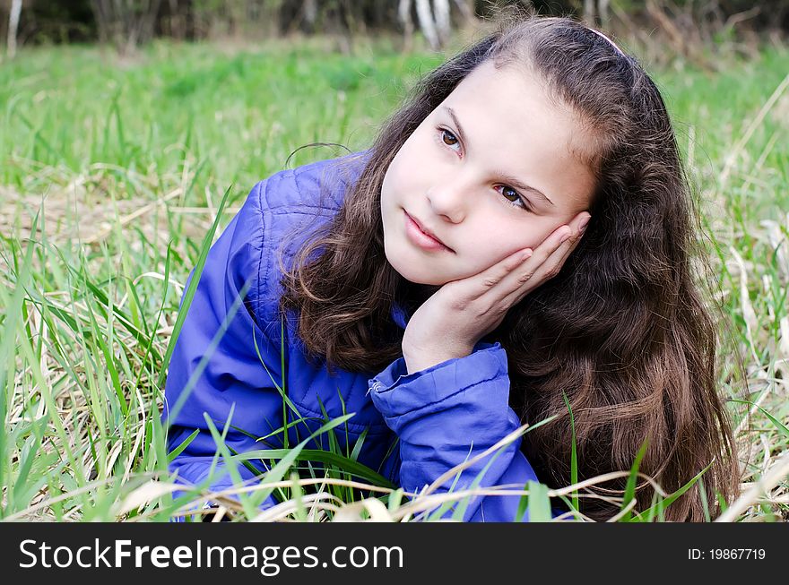 Portrait of the girl in grass
