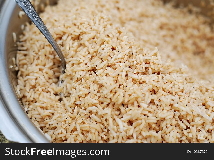 Large portion of glutinouos rice in pot, washed and seasoned for cooking. Large portion of glutinouos rice in pot, washed and seasoned for cooking.