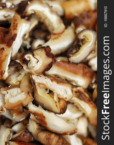 Freshly washed and cut mushroom pieces in Asian cuisine. Freshly washed and cut mushroom pieces in Asian cuisine.