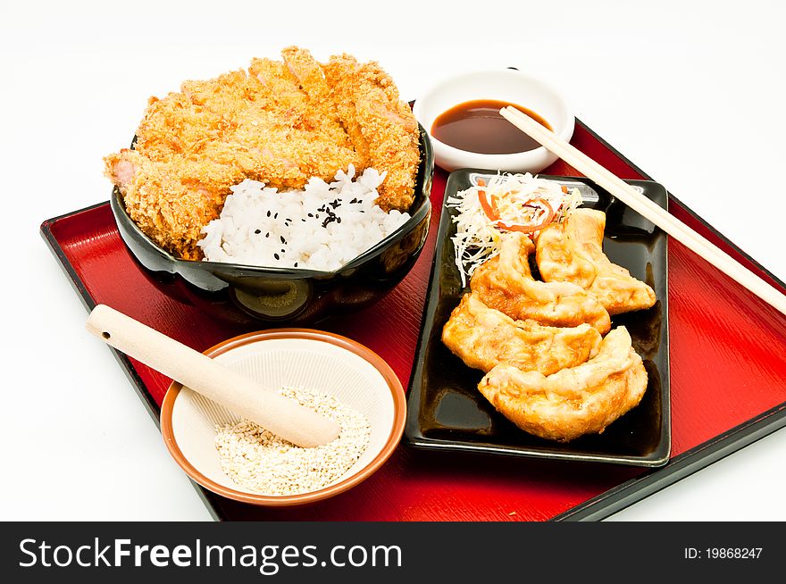 Rice and fried pork cutlet and Fried Dumplings on whit background