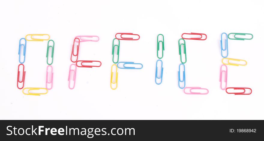 The inscription Office lined with colored paper clips on a white background