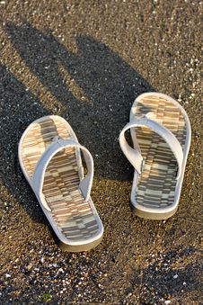 Flip Flops On The Beach Stock Images