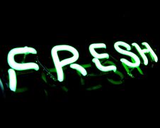 Fresh Neon Sign On Black Background Royalty Free Stock Photography