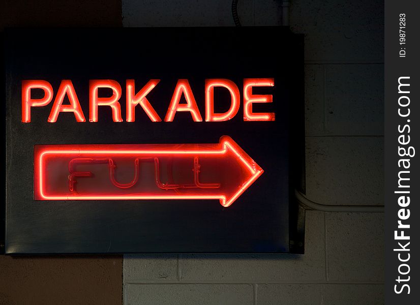 A neon sign indicating a parkade