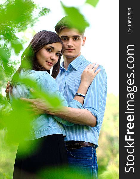 Romantic young couple standing in a field