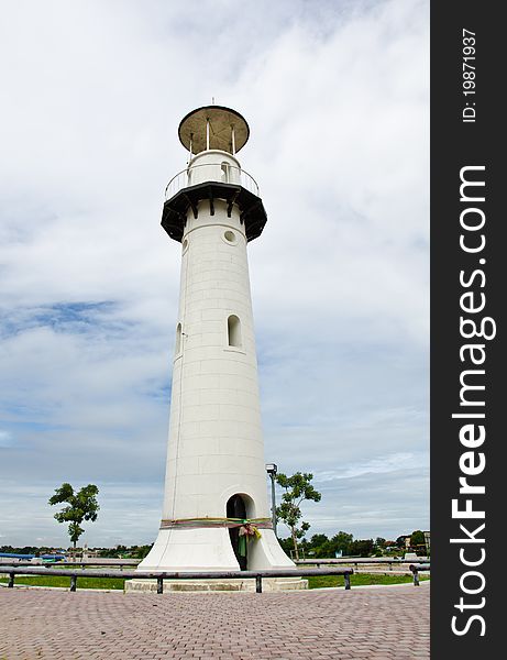 White lighthouse on the island in the middle river. Ayutthaya, Thailand. White lighthouse on the island in the middle river. Ayutthaya, Thailand.