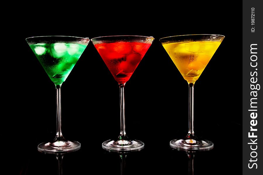 Various kinds of martini drinks on black background. Various kinds of martini drinks on black background