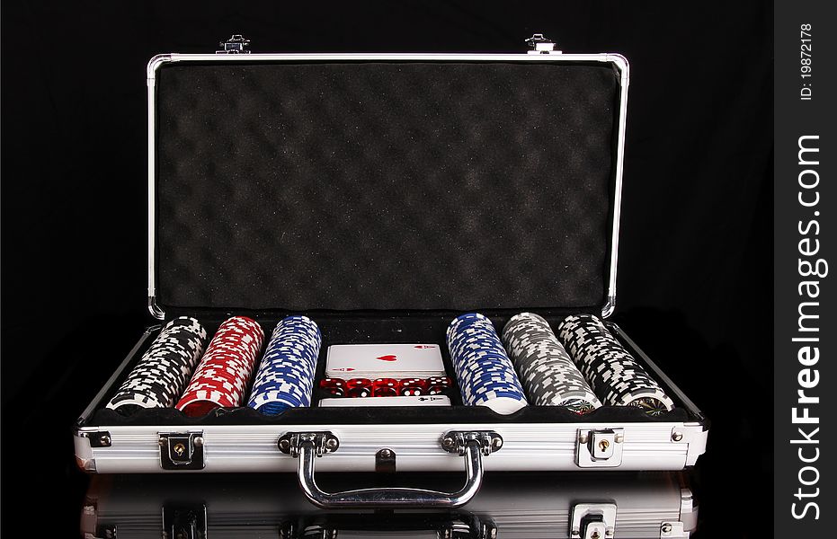 Poker equipment in case, isolated on black background