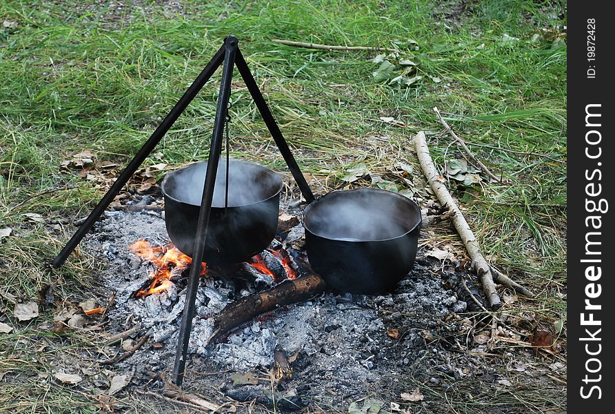 Preparing touristy food on campfire in wild camping. Preparing touristy food on campfire in wild camping