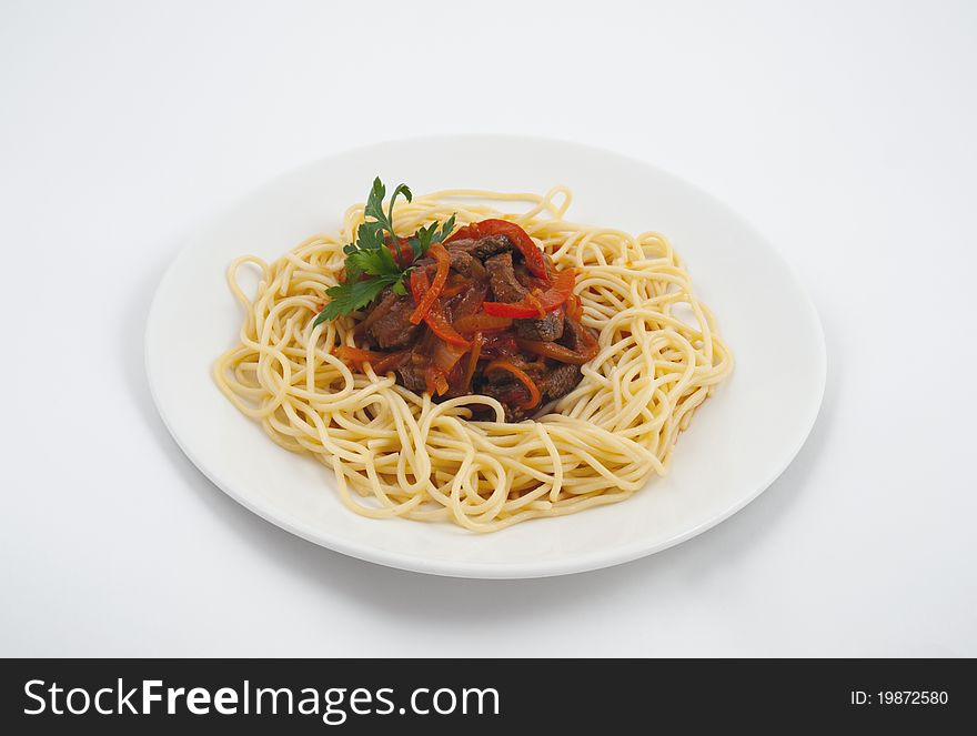 Photo of a spaghetti with creamy sauce and vegetables. Photo of a spaghetti with creamy sauce and vegetables