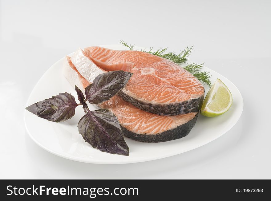 Raw salmon steak with herbs