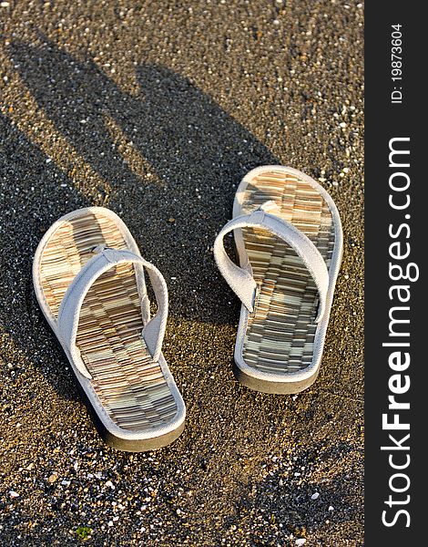 Flip flop on sandy beach in front of the sea. Flip flop on sandy beach in front of the sea